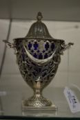A good Georgian design silver urn shaped cream vase and cover with sapphire blue glass liner,