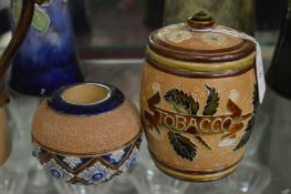A Doulton Lambeth Slaters Patent tobacco jar and cover together with a matched striker.