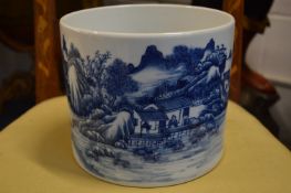 A large Chinese blue and white brush pot.