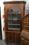 A George III design mahogany large standing corner cabinet.
