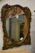 A decorative mirror, dressing table mirror and stool.