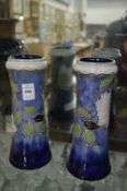 A pair of Royal Doulton vases.