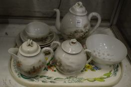 A Japanese hand painted porcelain part tea service.