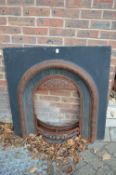 A Victorian cast iron fireplace.