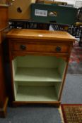 A small yew wood bookcase with a single drawer.