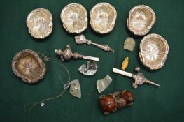 A Chinese piece of carved fruit, possibly cherry amber together with other collectables.