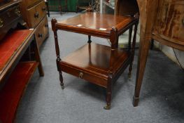 A mahogany two tier single drawer lamp table.