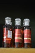 Six miniature bottles of Rastignac XO cognac.