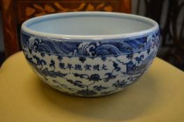 A Chinese blue and white bowl decorated with dragons.