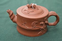 A Chinese Yxing teapot of naturalistic form.