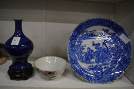 A Chinese blue glazed bottle vase on stand, a small circular porcelain dish and a Japanese blue