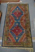 An old Persian rug, 152cm x 78cm.