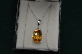 A good citrine and diamond pendant on a fine 14ct gold chain.