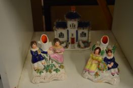 Two Staffordshire spill vases and a similar Pastille Burner cottage.