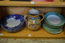 A group of armorial plates and other decorative china.