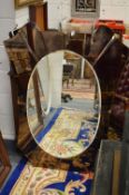 An unusual 1950's Italian mirror with coloured glass frame.