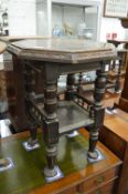 An oak octagonal shaped two-tier occasional table.