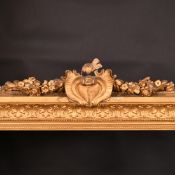 A 19th Century gilt composition frame with a central decorative cartouche, rebate size 14.5