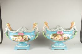 A LARGE PAIR OF SEVRES DESIGN PORCELAIN OVAL VASES with female mask handles, reverse oval panels
