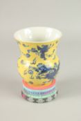 A CHINESE YELLOW GROUND DRAGON VASE AND STAND. Vase 14cms high