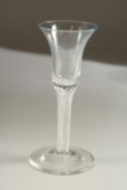 A GEORGIAN WINE GLASS with plain bowl and air twist stem. 15cms high.