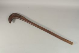 AN AFRICAN WOODEN AXE TYPE CLUB.