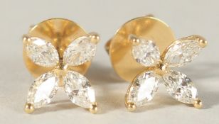 A PAIR OF 18CT YELLOW GOLD AND MARQUISE DIAMOND FLOWER EAR STUDS.