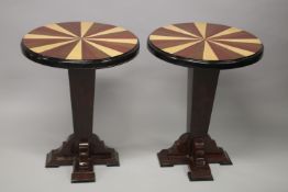 A PAIR OF INLAID ART DECO DESIGN STAR TOP CIRCULAR TABLES on column supports. 74cms high x 60cms