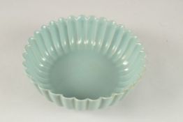 A CHINESE CELADON PETALS SHAPE BOWL. 22.5cms diameter.