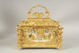 A LARGE GILT BRONZE CASKET with porcelain panels with velvet interior. 30cms high x 20cms wide.