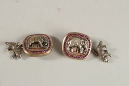 A PAIR OF RUSSIAN SILVER AND RUBY ELEPHANT CUFFLINKS. Weight 28grms.