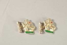 A PAIR OF RUSSIAN SILVER AND GREEN ENAMEL DOG CUFFLINKS. Weight 18grms.