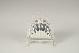 A SILVER PLATED SHELL SHAPED BISCUIT AND CHEESE STAND.