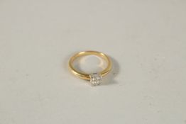 A FOUR STONE SQUARE DIAMOND RING. Ring size L.