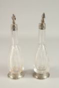 A VERY GOOD PAIR OF CONTINENTAL, POSSIBLY GERMAN, CRYSTAL GLASS AND SILVER MOUNTED SCENT BOTTLES AND