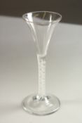 A GEORGIAN WINE GLASS with tapering bowl and air twist stem. 16cms high.