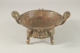 A BRONZE TWO-HANDLED CIRCULAR CENSER with calligraphy. 18cms diameter.