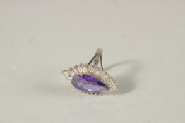AN AMETHYST AND CZ TEAR DROP RING. Ring size O-P.