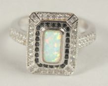 A SILVER OPAL ART DECO STYLE RING.