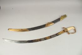 A FINE 1796 OFFICER'S SABRE with ivory handle and blue etched blade in a leather and brass sheath.