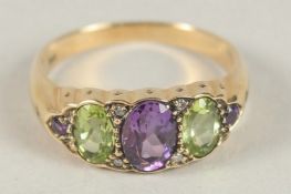 A 9CT GOLD PERIDOT, AMETHYST AND DIAMOND RING.