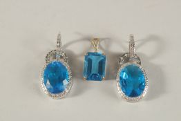 A PAIR OF BLUE OVAL PENDANTS and a rectangular pendant (3).