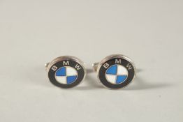 A PAIR OF STERLING SILVER AND ENAMEL BMW EMBLEM CUFFLINKS.