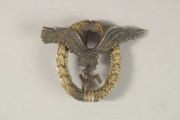 A WWII GERMAN PILOT'S BADGE.