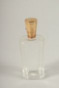 AN 18TH CENTURY GOLD TOP SCENT BOTTLE in a leather case.