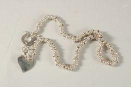 A TIFFANY SILVER NECKLACE, boxed.