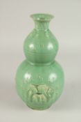 A CHINESE DOUBLE GOURD JIAN WARE VASE. 28cms high.