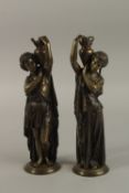 A GOOD PAIR OF 19TH CENTURY FRENCH BRONZE CLASSICAL FEMALE FIGURES carrying pitchers, on circular