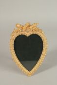 A GILT METAL HEART SHAPED PHOTOGRAPH FRAME. 20cms.