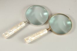 TWO MAGNIFYING GLASSES with mother-of-pearl handles.